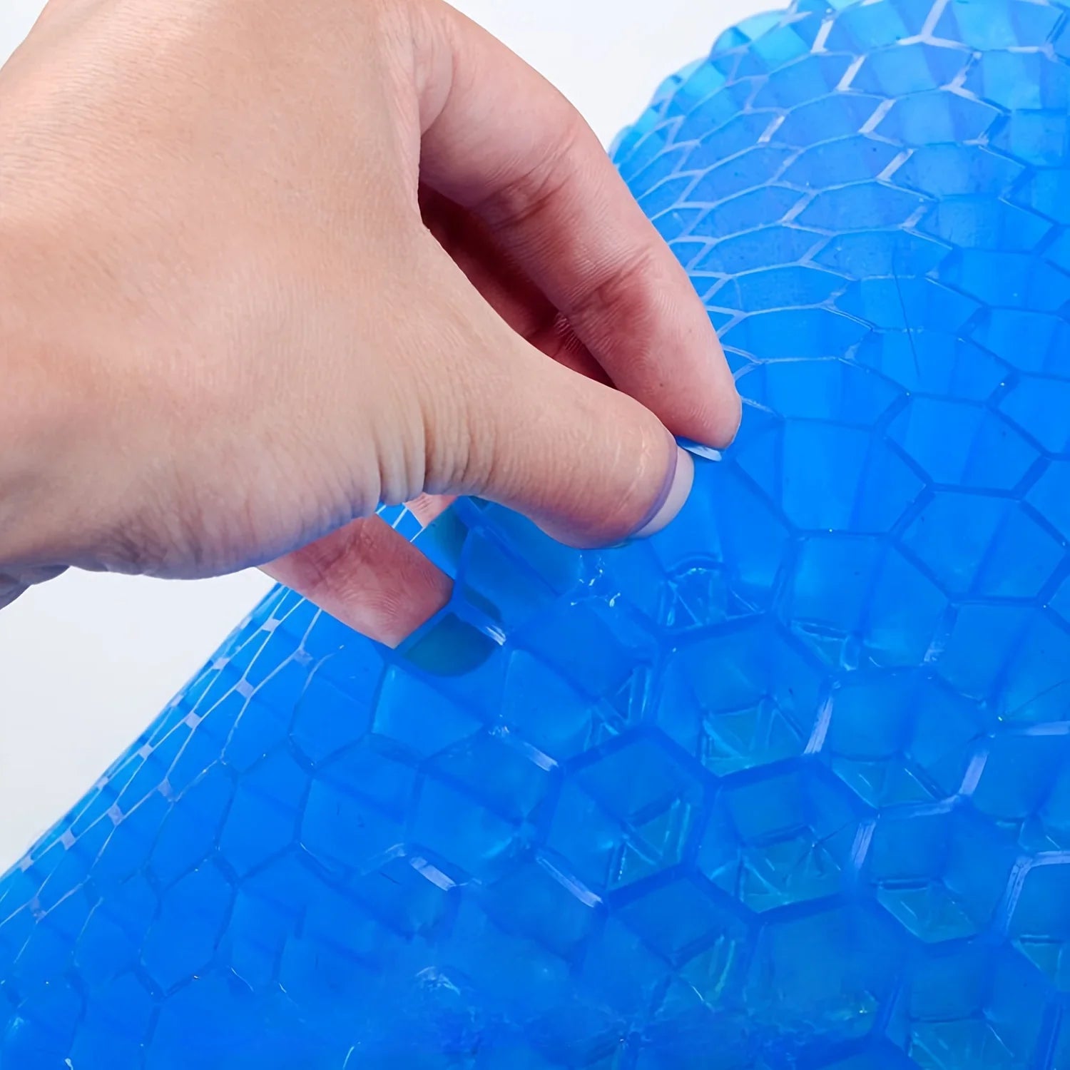Water-resistant gel wheelchair cushion featuring a breathable honeycomb design for comfort and support.
