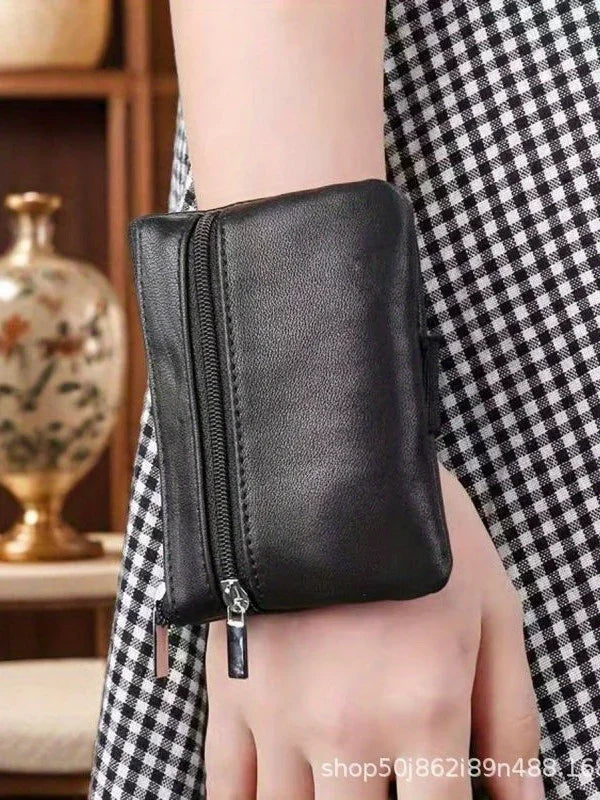 Easy access wrist purse by MobilityBuy, featuring compartments for cards, cash, and keys, designed for disability use.