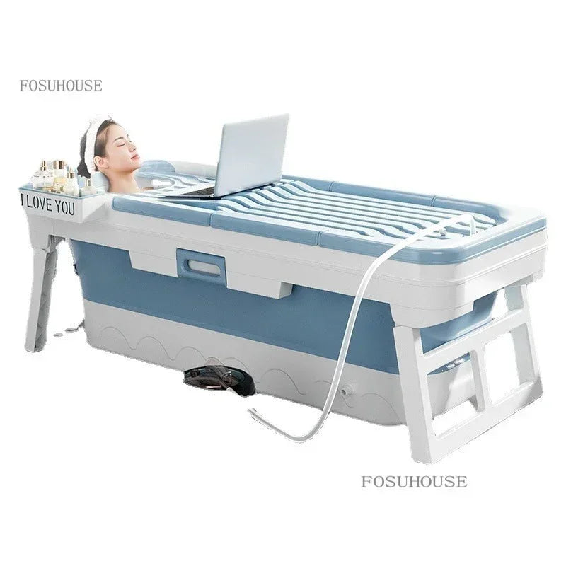 Portable folding plastic bathtub for adults in white and blue with side tray and foldable legs