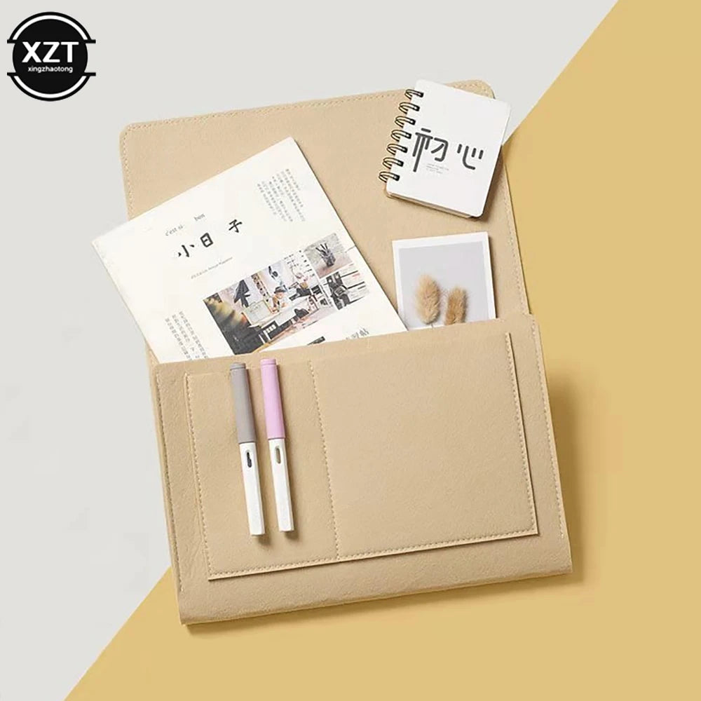Felt bedside storage organizer by XZT with hanging pockets in beige; includes magazine/phone pockets and pen slots