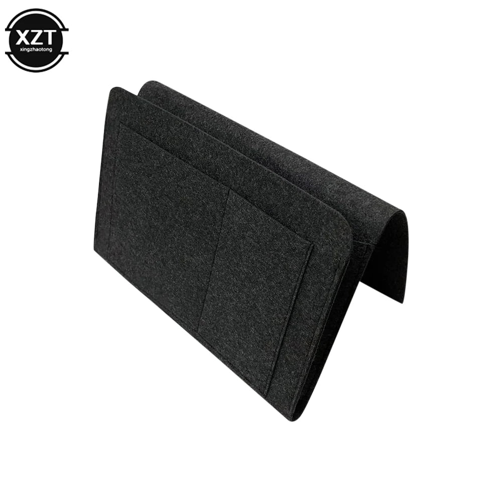 Felt bedside storage organizer in black with hanging pockets for phone, books, magazines and tissues