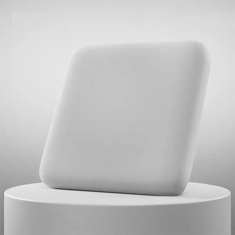 Ultra thick soft foam seat cushion for office chair or car seat, white, displayed on pedestal