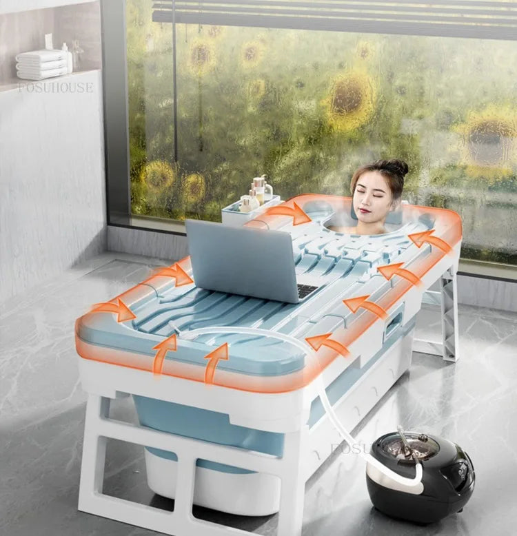 Portable folding plastic adult bathtub with white frame and blue tub, indoor home spa setup.