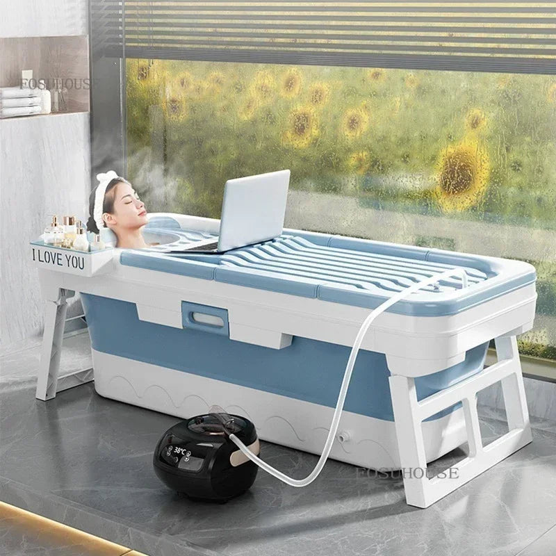 Portable folding bathtub for adults in blue and white with lid, ice bath setup and pump.