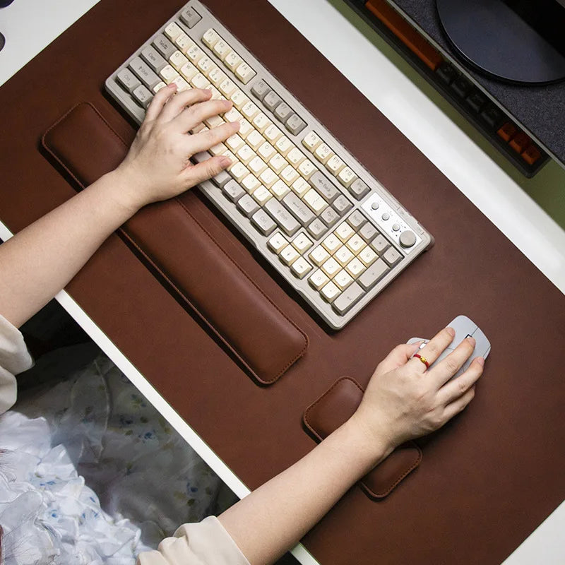 Three-piece desk mat set in brown PU leather with two wrist rests and large mouse pad; MobilityBuy.com