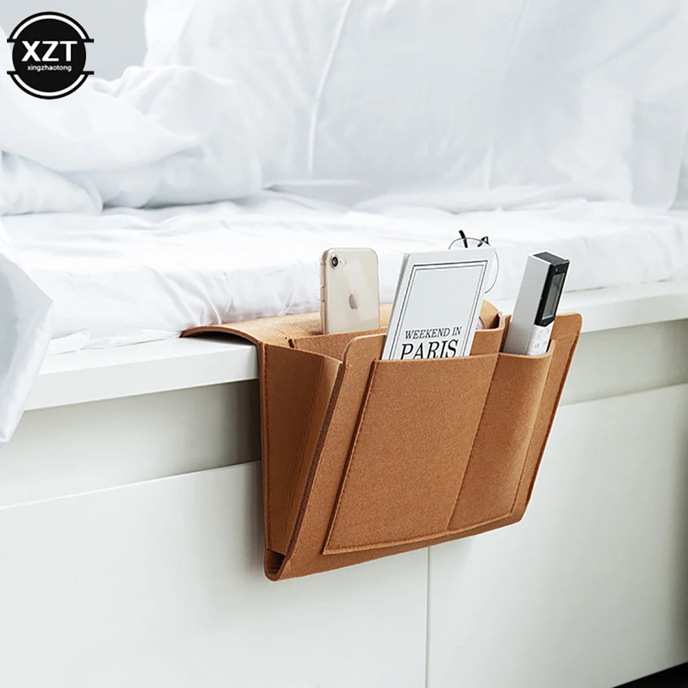 Felt bedside storage organizer with three pockets in brown, holds phone, magazine and remote; XZT logo visible.