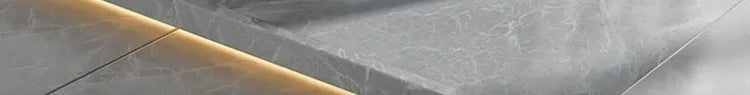 Portable folding bathtub on grey tile floor backdrop