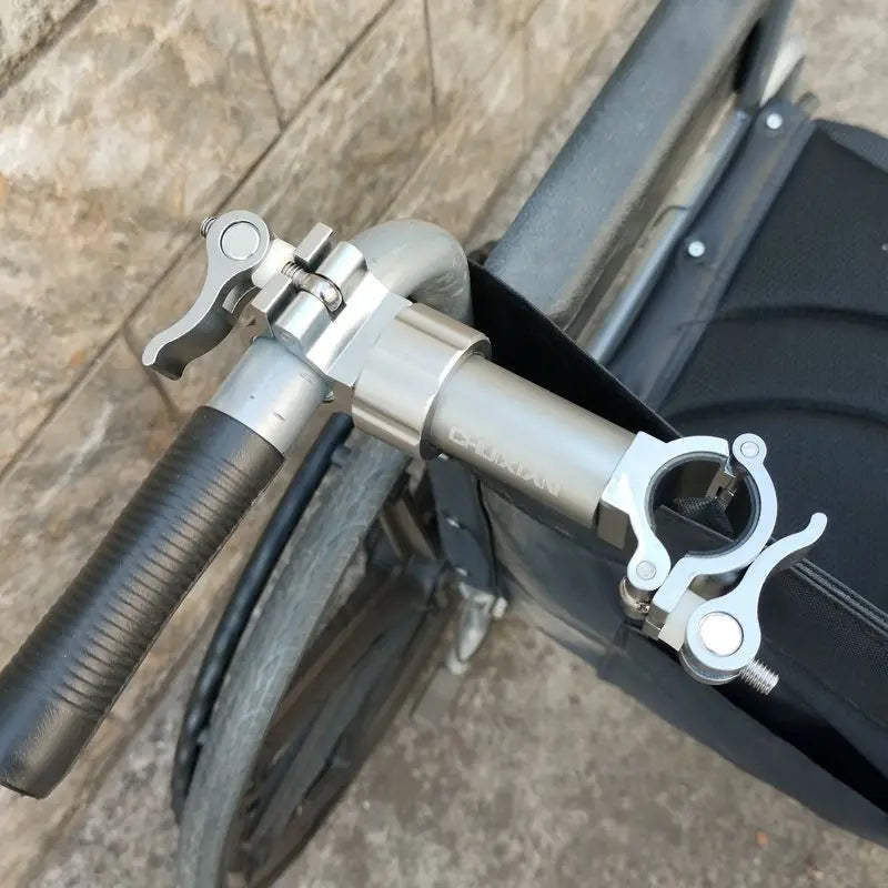 Aluminum magnesium alloy cane clip fixing device mounted on a mobility scooter handlebar with buckle clamps