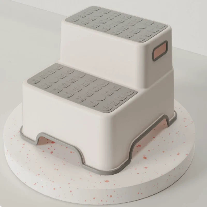 Two-tier kids safety step stool with white body, gray non-slip treads and side handles